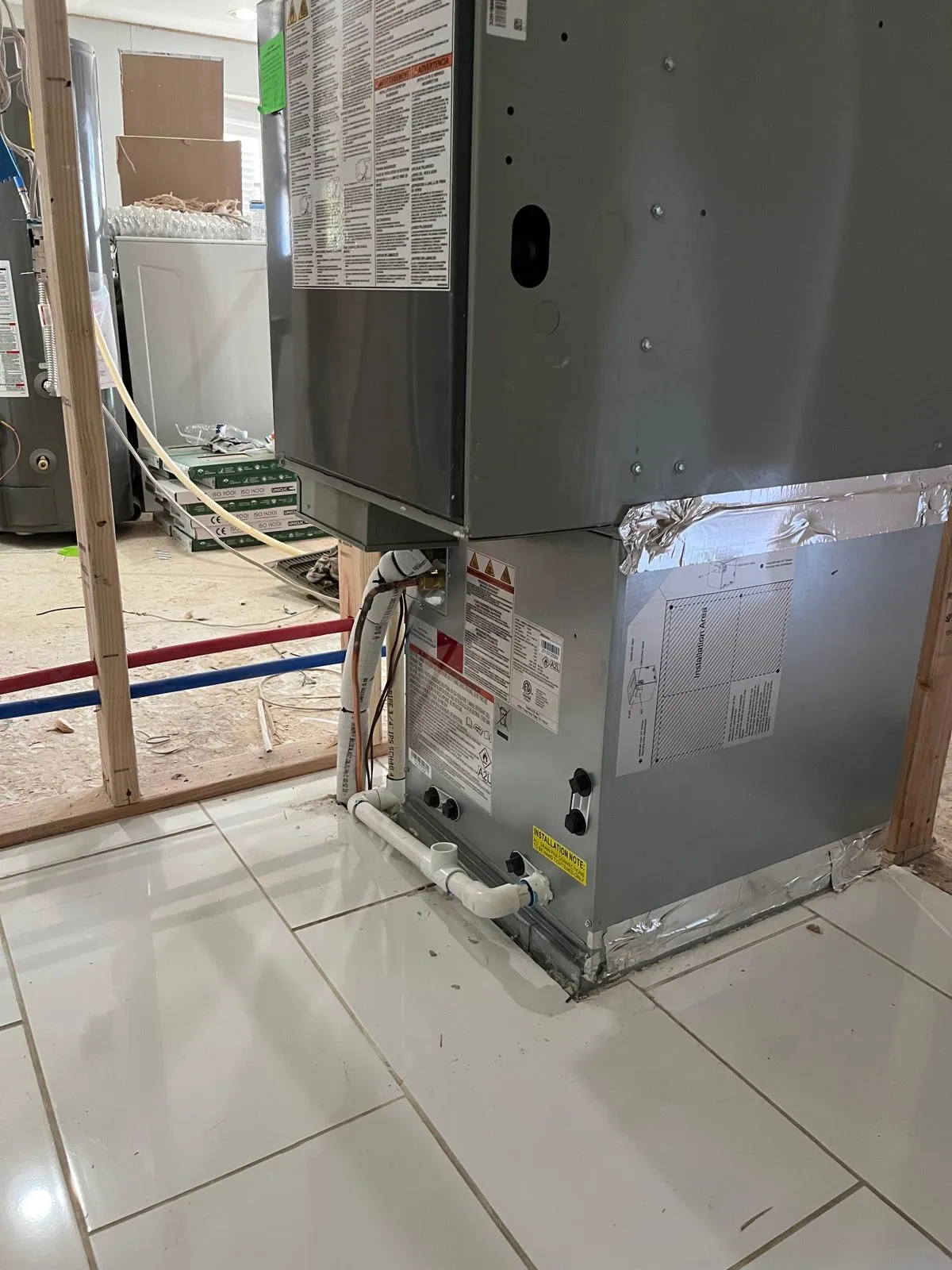 New downflow furnace and coil installed during a Salt Lake City home remodel with open framing