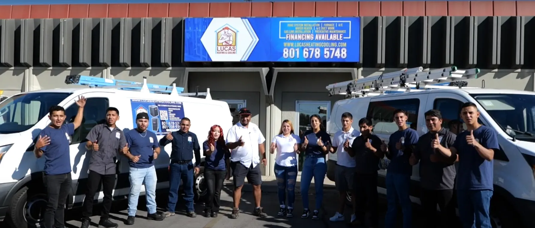 The full Lucas Heating and Air crew giving thumbs up outside the Salt Lake City shop