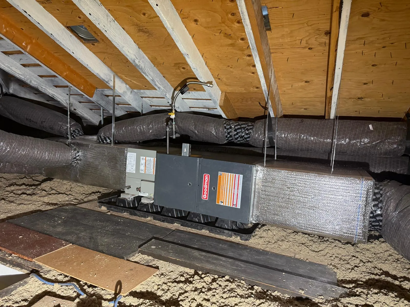 Goodman furnace and air handler installed on an attic platform in Murray with insulated duct runs