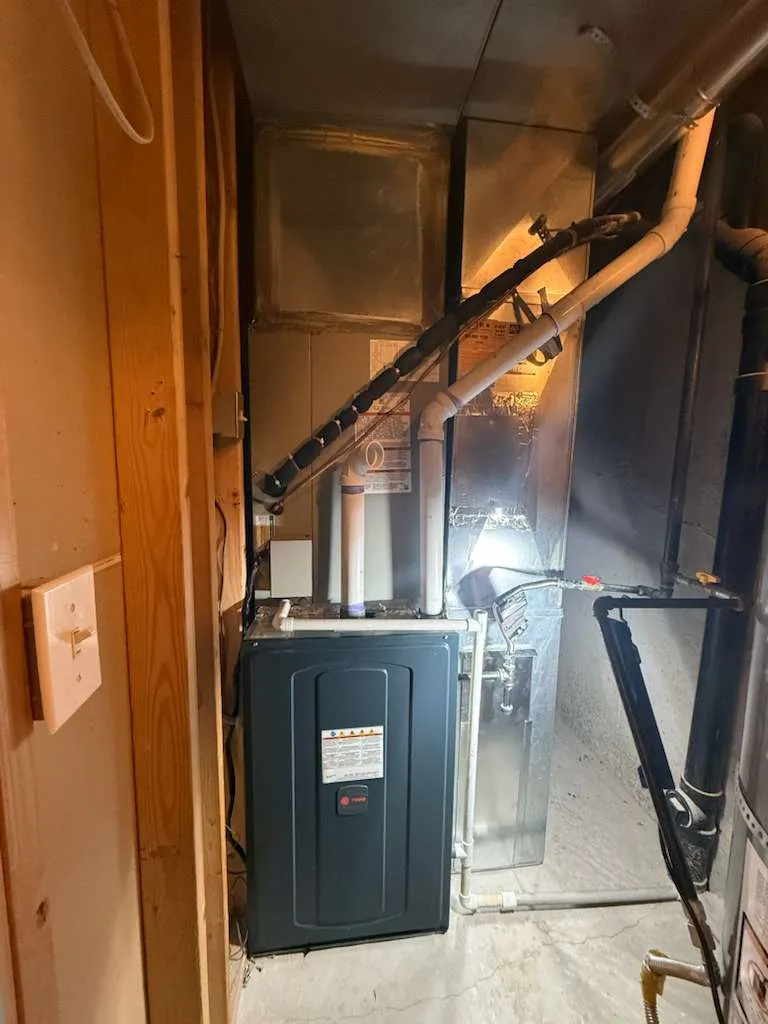 High-efficiency Trane furnace installed by Lucas Heating and Air in a tight Utah utility closet